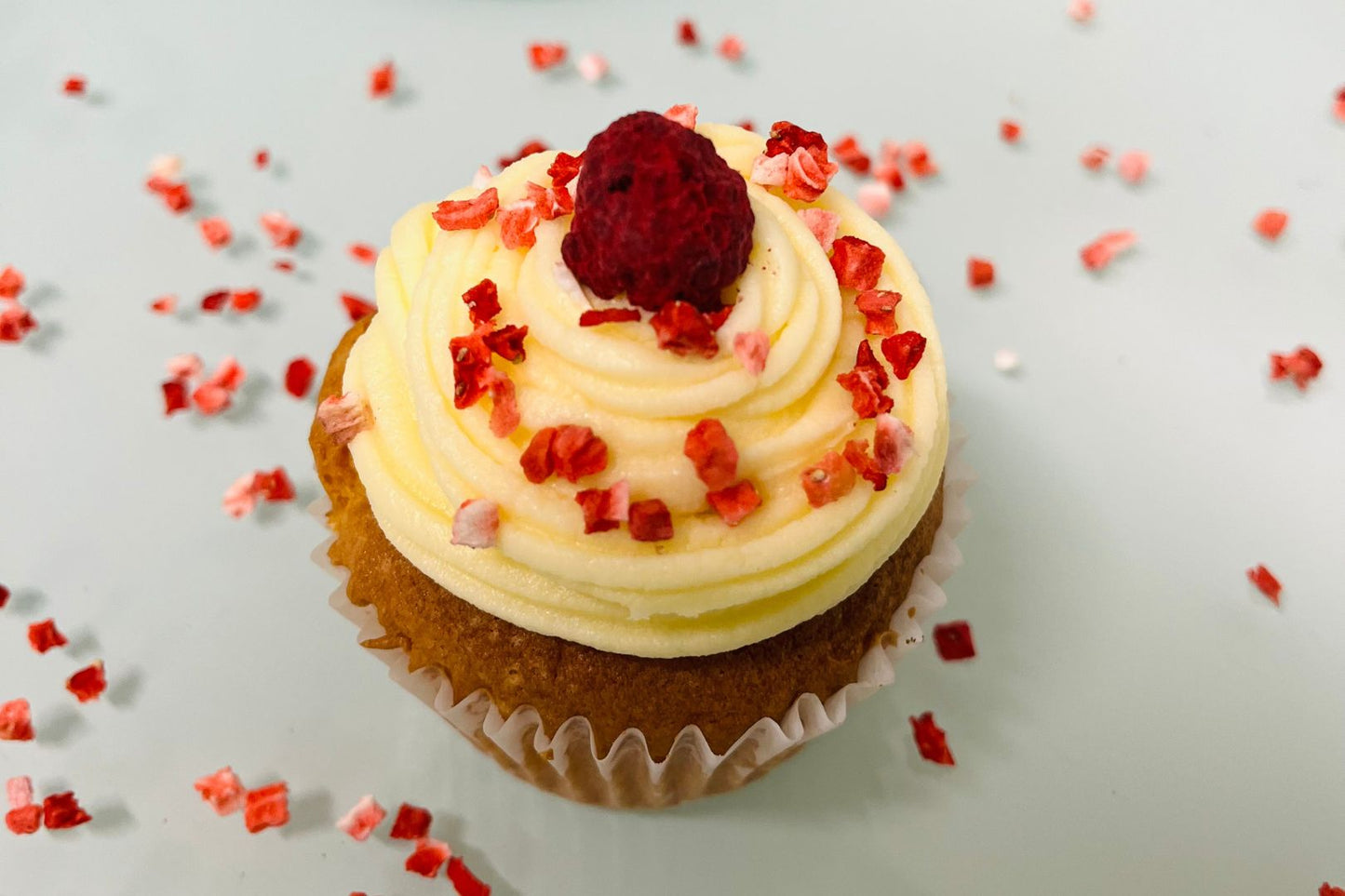 Freeze dried raspberry crumble on cupcakes